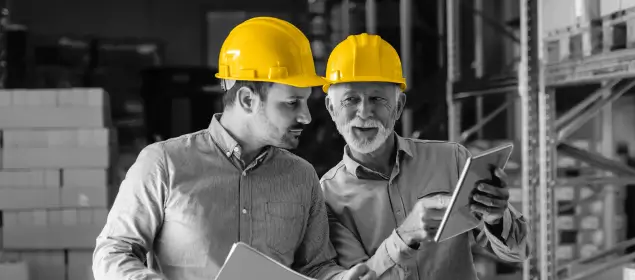 Two TRAFFIX employees in a warehouse